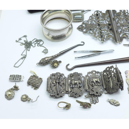 1089 - Silver, white metal and plated jewellery, a silver napkin ring, silver button hooks, etc.