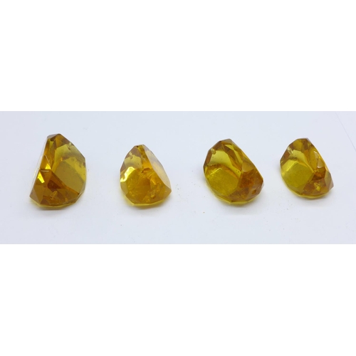 1106 - Four citrine stones, total weight 23.8g, (removed from swivel fobs, a/f)