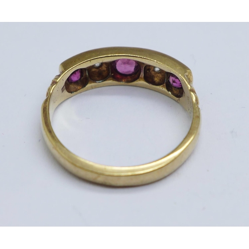 1114 - A 9ct gold, ruby and diamond ring, 3.0g, M