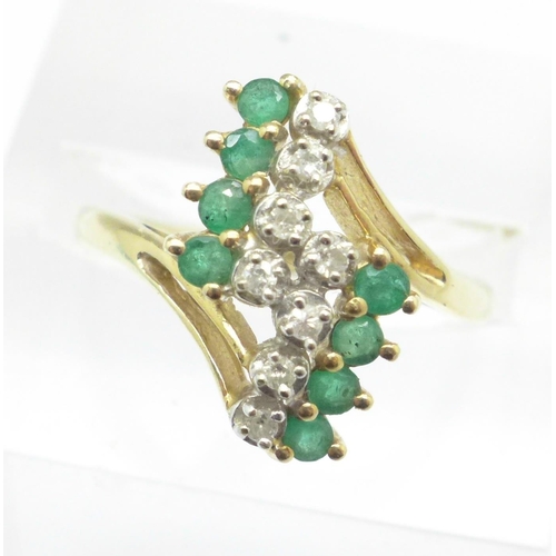 1124 - A yellow metal, emerald and diamond ring, marked 585, 3.5g, S