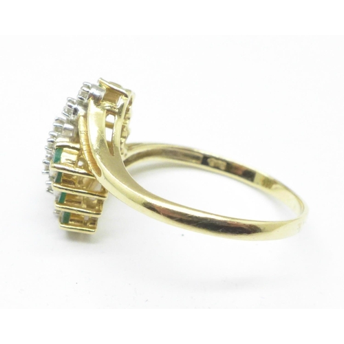 1124 - A yellow metal, emerald and diamond ring, marked 585, 3.5g, S