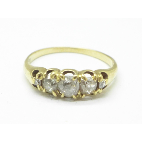 1128 - An 18ct gold five stone diamond ring, 2.2g, O