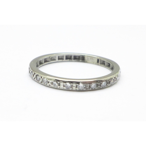 1133 - A white metal and diamond half eternity ring, tests as platinum, 3.4g, S