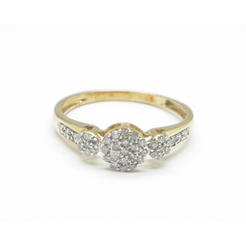 1135 - A diamond cluster ring with diamond shoulders, O/P