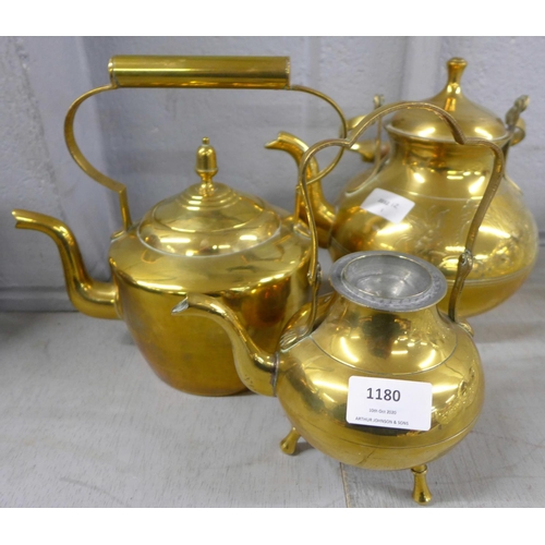 1180 - Three brass teapots