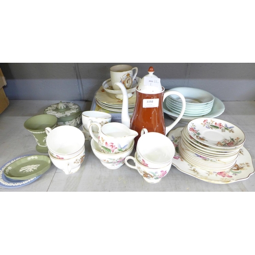 1192 - A box of china, a Wedgwood six setting tea set, one plate and sugar bowl a/f, a Susie Cooper coffee ... 