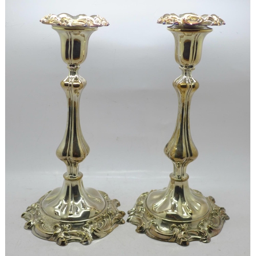 605 - A pair of Sheffield plate candlesticks