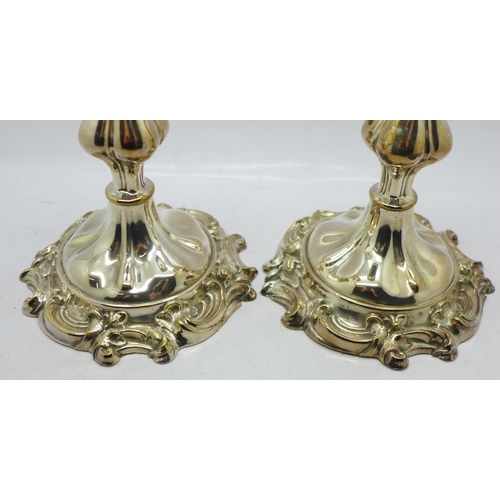 605 - A pair of Sheffield plate candlesticks