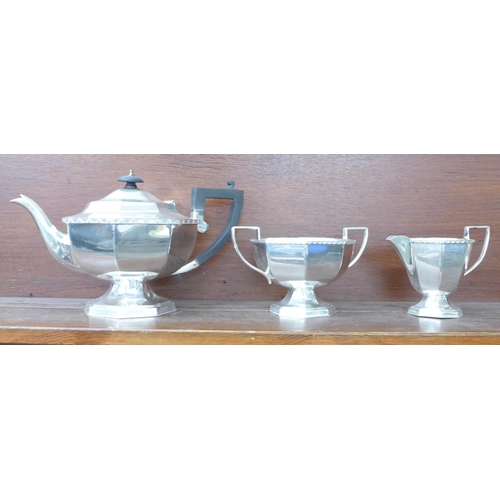 614 - An Art Deco three piece plated tea service, marked Triple Plate