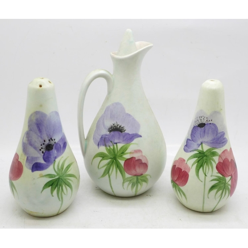 627 - A hand painted condiment set; salt, pepper and oil/vinegar, possibly E Radford