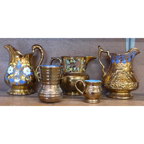 644 - Four copper lustre jugs and a lustre vase