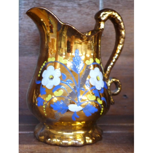 644 - Four copper lustre jugs and a lustre vase