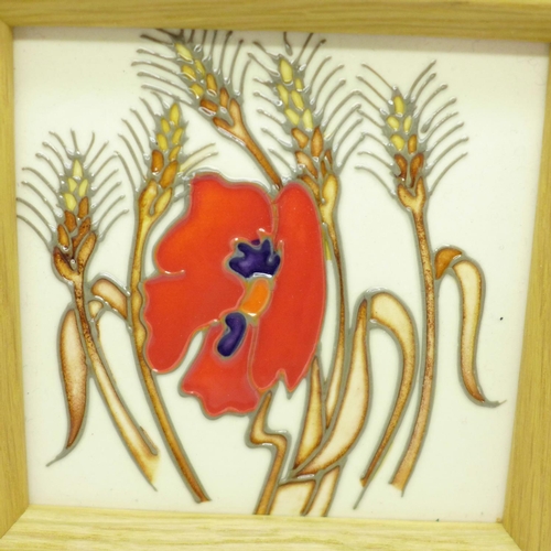 647 - A Moorcroft framed tile, 'Harvest Poppy' design, by Emma Bossons