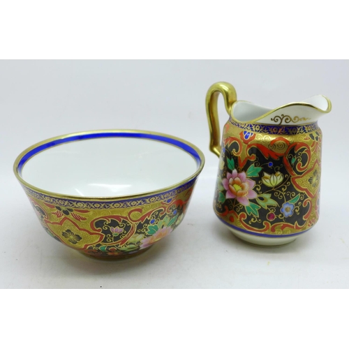 651 - An early 20th Century Noritake hand decorated bowl and milk jug, signed underside, height 10.7cm, di... 