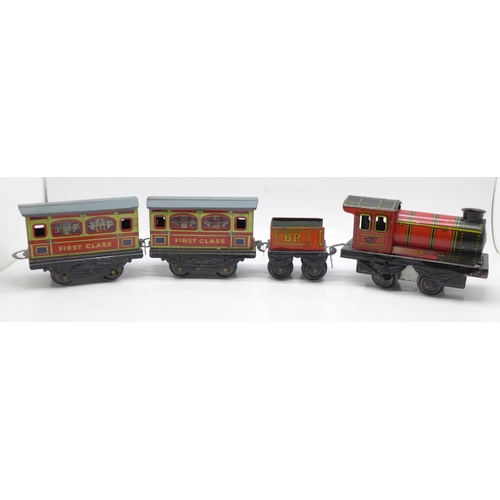 653 - A Brimtoy tinplate locomotive, tender and two carriages