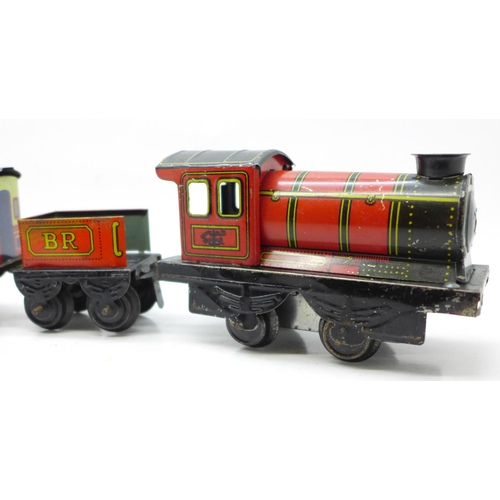 653 - A Brimtoy tinplate locomotive, tender and two carriages