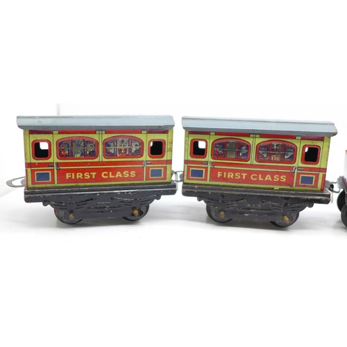 653 - A Brimtoy tinplate locomotive, tender and two carriages