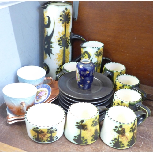 658 - A Newlyn tea set, including 6 cups, 6 saucers, sugar bowl and a milk jug, two Royal Winton cups on s... 