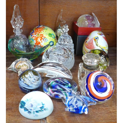 668 - A collection of glass paperweights and a glass inkwell, etc.