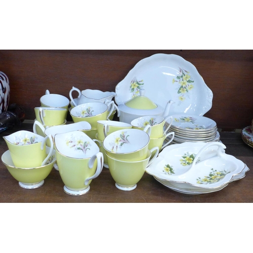 670 - Royal Albert Primrose tea and coffee wares, nut dish, cream and sugars