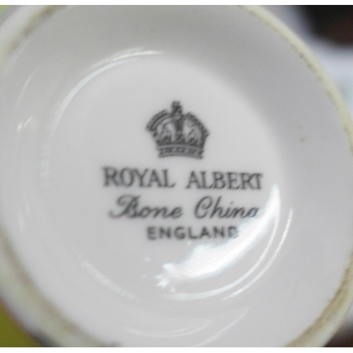 670 - Royal Albert Primrose tea and coffee wares, nut dish, cream and sugars