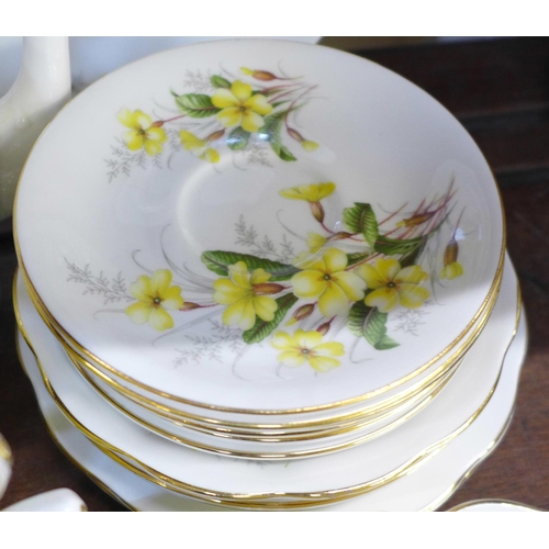 670 - Royal Albert Primrose tea and coffee wares, nut dish, cream and sugars