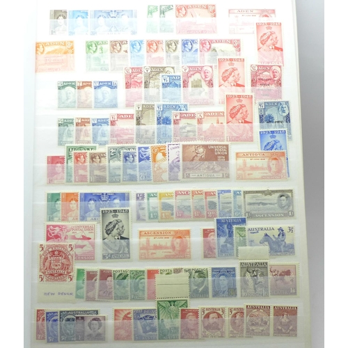 678 - Stamps:- KGVI Commonwealth mint stamps in stock book with sets and part sets, noted GB £1 silver wed... 