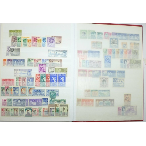 678 - Stamps:- KGVI Commonwealth mint stamps in stock book with sets and part sets, noted GB £1 silver wed... 