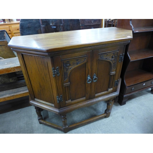 206 - A carved oak two door credence cupboard