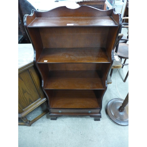 207 - A mahogany open waterfall front bookcase