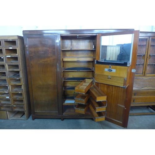 227 - An early 20th Century mahogany three door Compactum wardrobe