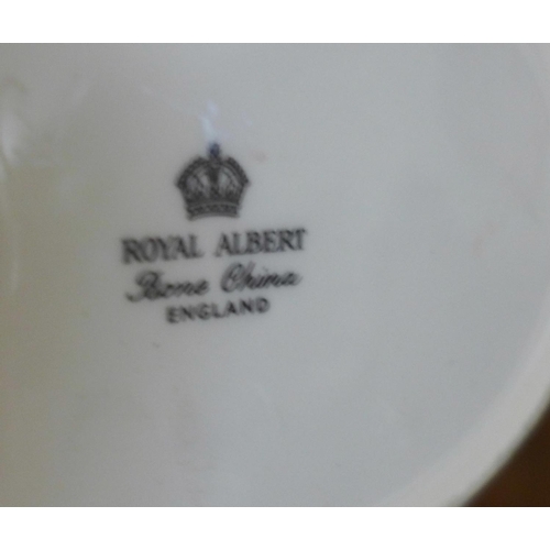 704 - A Royal Albert Primrose coffee set and vases, bowls, etc.