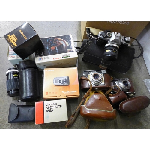 722 - A Canon AE-1 camera with box and other camera equipment, a Printflex Zoom lens, other lenses and two... 