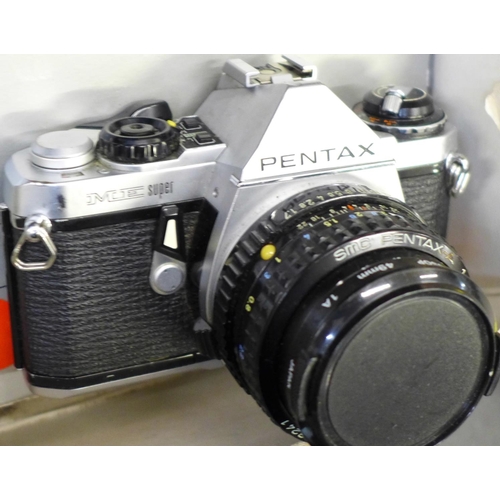 747 - A box of camera equipment including two lenses, Pentax ME Super, Olympus digital, Canon EOS 33 and f... 