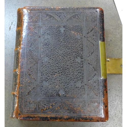 771 - An 1876 Bible, with brass clasp (Church volume)