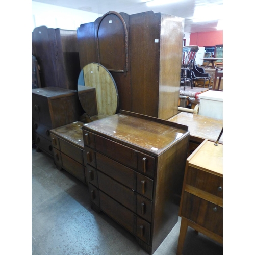 295 - An Art Deco oak three piece bedroom suite