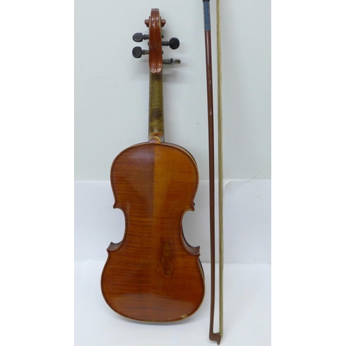 803 - A ¾ violin and bow, cased, length of back without button, 33.5cm