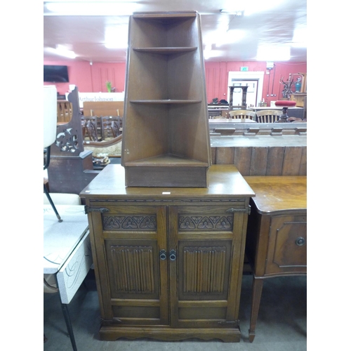 322 - An Old Charm oak TV cabinet and a corner bookcase