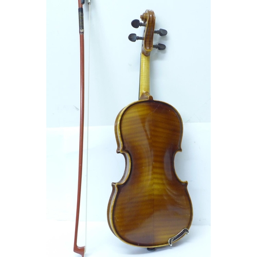 806 - A Golden Strad ¼ size violin and bow, cased, length of back without button 26.25cm