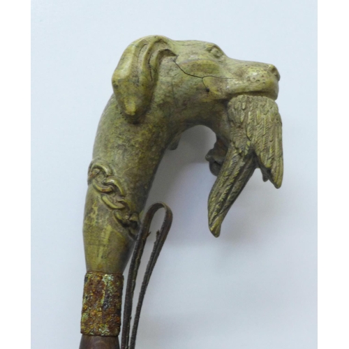 810 - A shoehorn with novelty carved dog's head handle