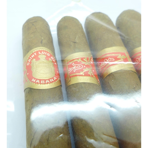 820 - Saint Luis Rey, four Cuban cigars, two Honduras Coronas in original box and a full pack of Churchman... 