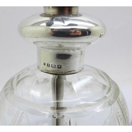 823 - A silver top glass scent atomiser and a silver top scent bottle