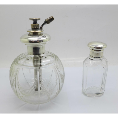 823 - A silver top glass scent atomiser and a silver top scent bottle