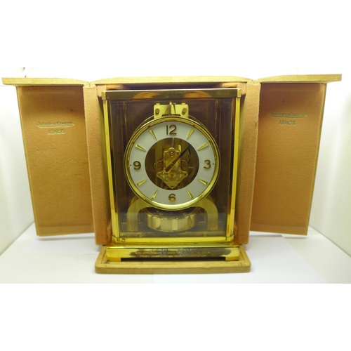 827 - A Jaeger-Le-Coultre Atmos clock, with long service inscription, cased, a/f, minute hand missing