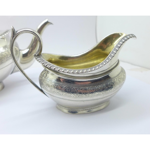 833 - A three piece silver tea service, London 1878, 604g