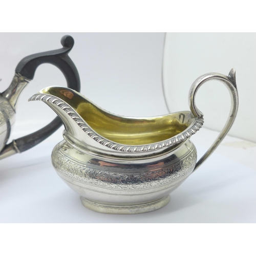 833 - A three piece silver tea service, London 1878, 604g