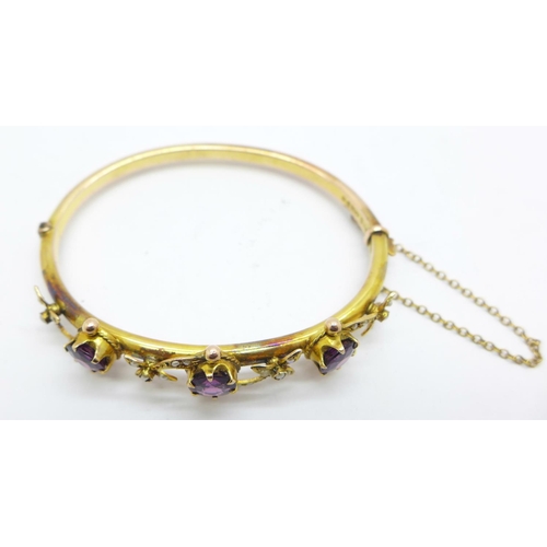 854 - An Edwardian 9ct gold, amethyst and seedpearl bangle, Chester 1907, in original Brittain, Mansfield ... 