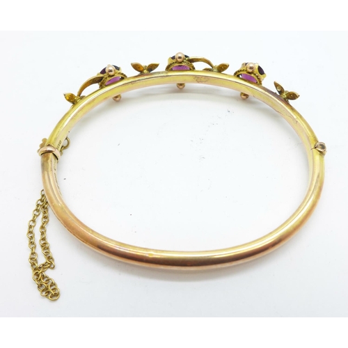 854 - An Edwardian 9ct gold, amethyst and seedpearl bangle, Chester 1907, in original Brittain, Mansfield ... 