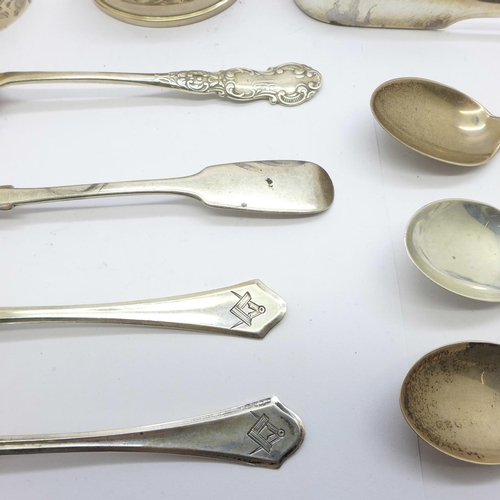 855 - Seven silver spoons, a pair of silver sugar bows and two silver napkin rings, 180g