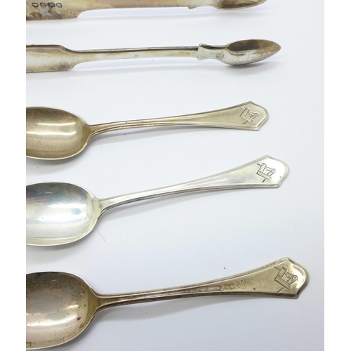 855 - Seven silver spoons, a pair of silver sugar bows and two silver napkin rings, 180g